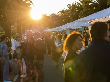 Overlook the vineyards as the sun sets over Seppeltsfield Road’s Avenue of Palms.