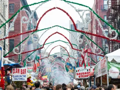 Little Italy comes alive with lights, carnival booths and food...