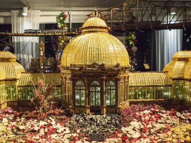 Model trains navigate painstakingly crafted miniatures of New York City's...