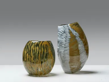 Artists from Ninuku Arts collaborate with JamFactory’s Glass Studio to create unique glass vessels featuring the artists hand painted bold designs.